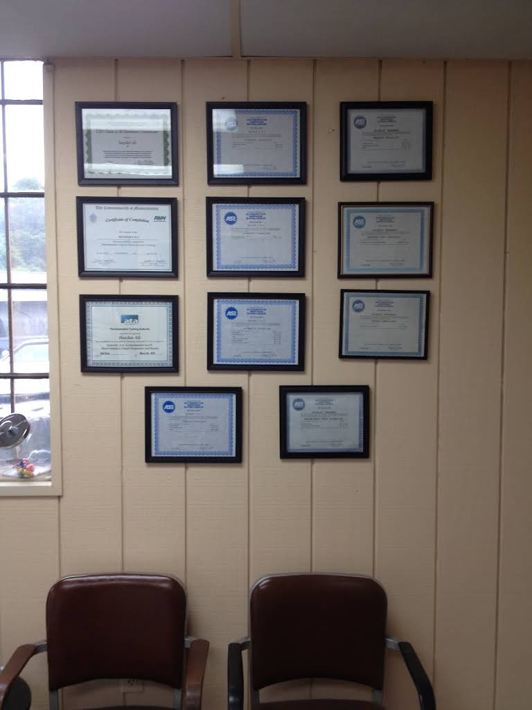 ASE certifications on the wall inside Central Automotive's Hyde Park waiting room